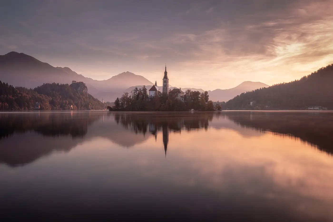 Lake Bled at sunrise during a Slovenia photography tour with soft morning light and reflections on the lake