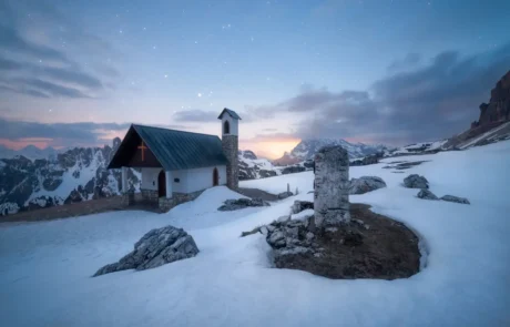 Mountain chapel near Rifugio Auronzo before sunrise in the Dolomites, Italy.