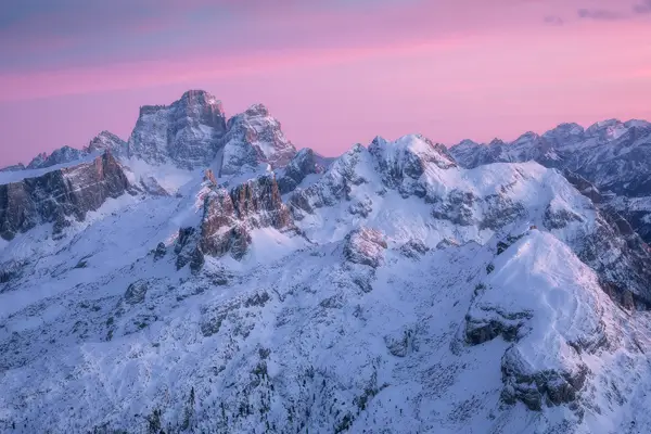 Snow-covered peaks around Lagazuoi at sunrise in the Italian Dolomites during winter